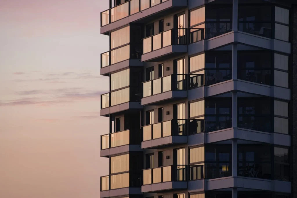 Multi-story apartment building with stacked balconies